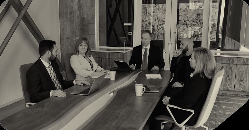 John Oberg speaking with attendees at an event